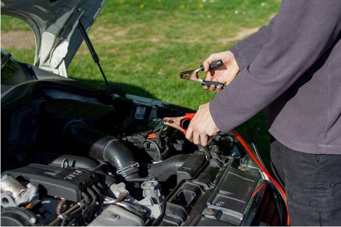 Technician changing oil